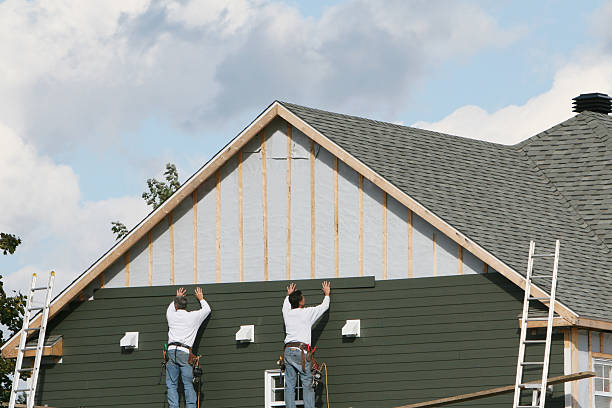 Professional Siding Contractor technician working in Center Cross, VA